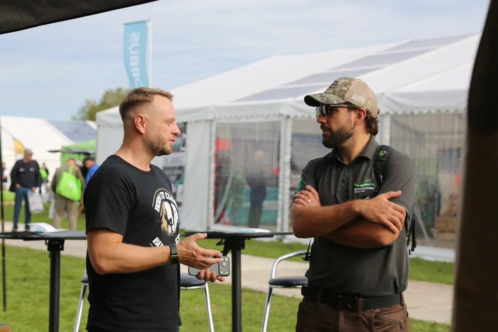 Two arborists talking at the ArboStar stand at APF 2026